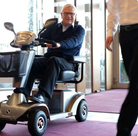 Man in mobility scooter